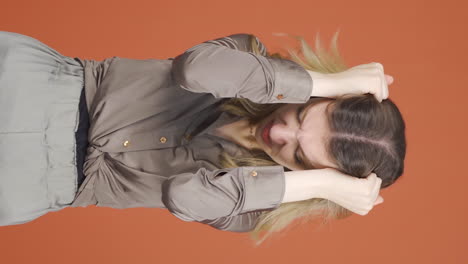 Vertical-video-of-Young-woman-having-a-nervous-breakdown-in-front-of-the-camera.